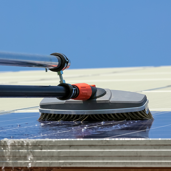Broom scrubbing solar panels